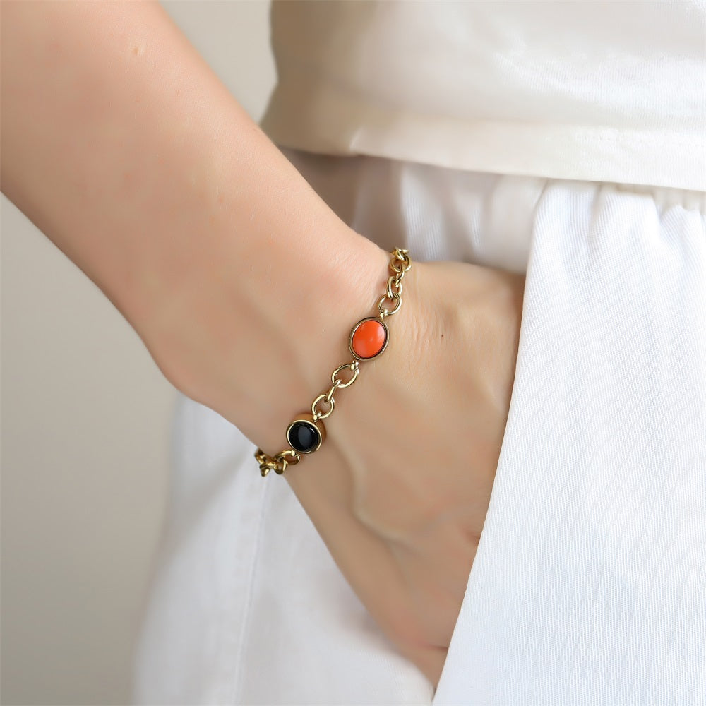 AAB gold-plated stainless steel bracelet with black onyx and synthetic red turquoise, custom jewelry manufacturer