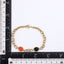 AAB gold-plated stainless steel bracelet with black onyx and synthetic red turquoise, custom jewelry manufacturer