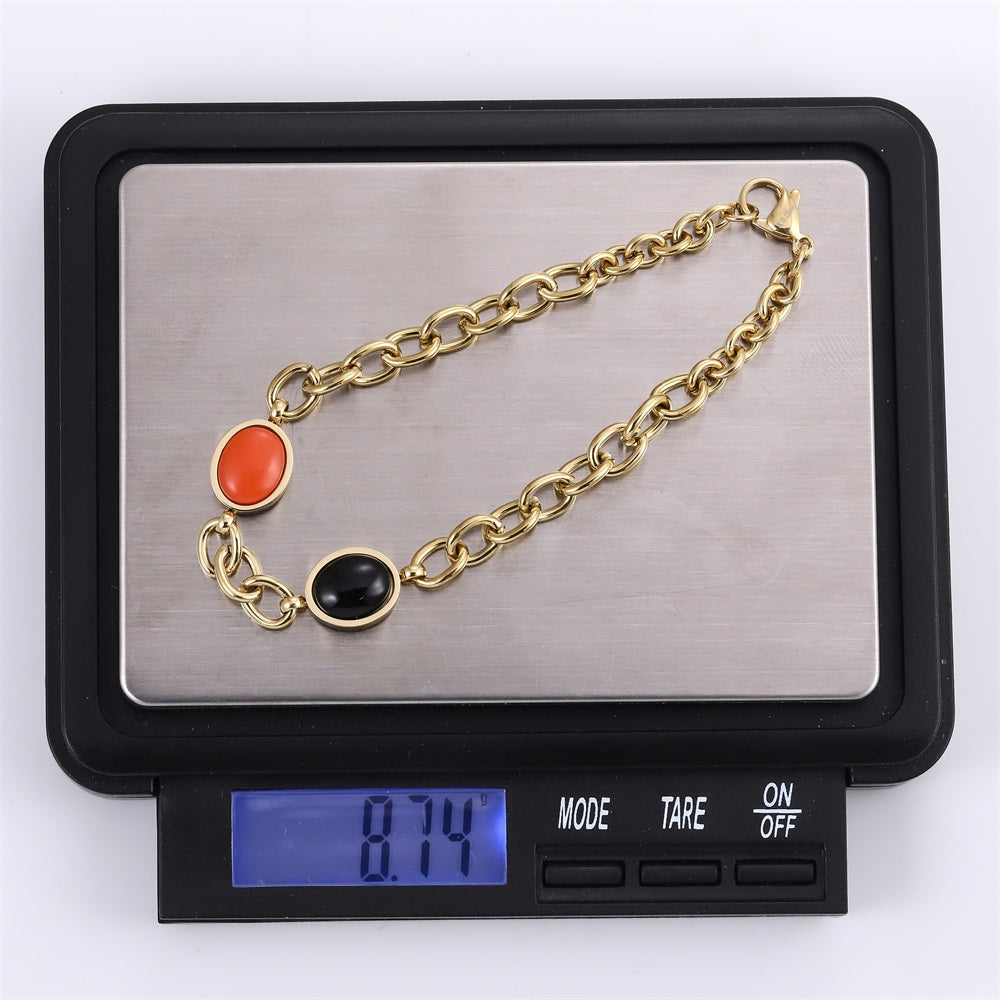 AAB gold-plated stainless steel bracelet with black onyx and synthetic red turquoise, custom jewelry manufacturer
