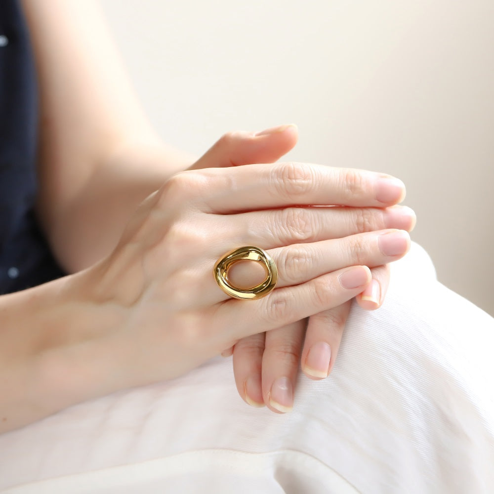 AAB organic oval stainless steel ring in polished gold finish, modern artistic jewelry, unisex custom jewelry supplier