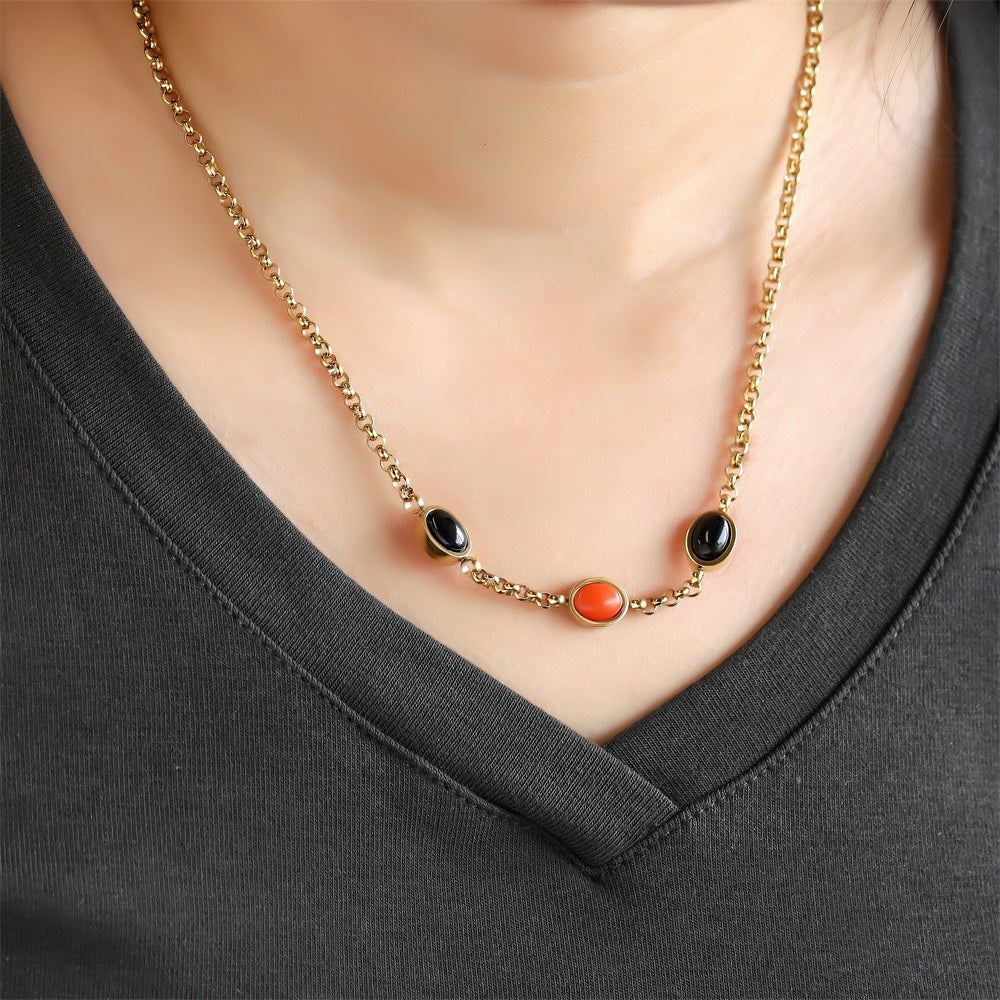 AAB gold-plated stainless steel necklace with black onyx and synthetic red turquoise, custom jewelry manufacturer