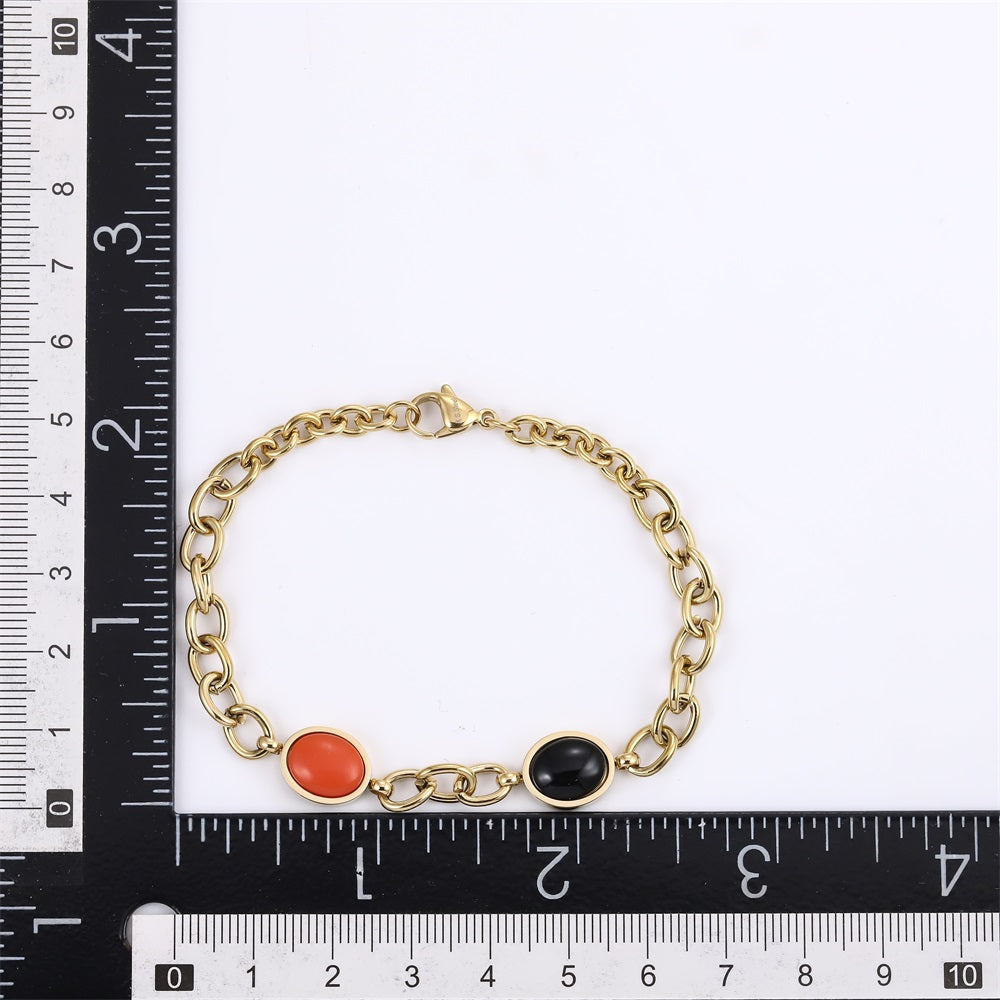 AAB gold-plated stainless steel bracelet with black onyx and synthetic red turquoise, custom jewelry manufacturer