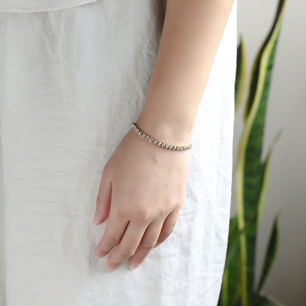 Close-up of stainless steel CZ tennis bracelet on wrist.