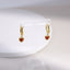 ESS897 STAINLESS STEEL HOOP EARRING WITH HEART CHARM
