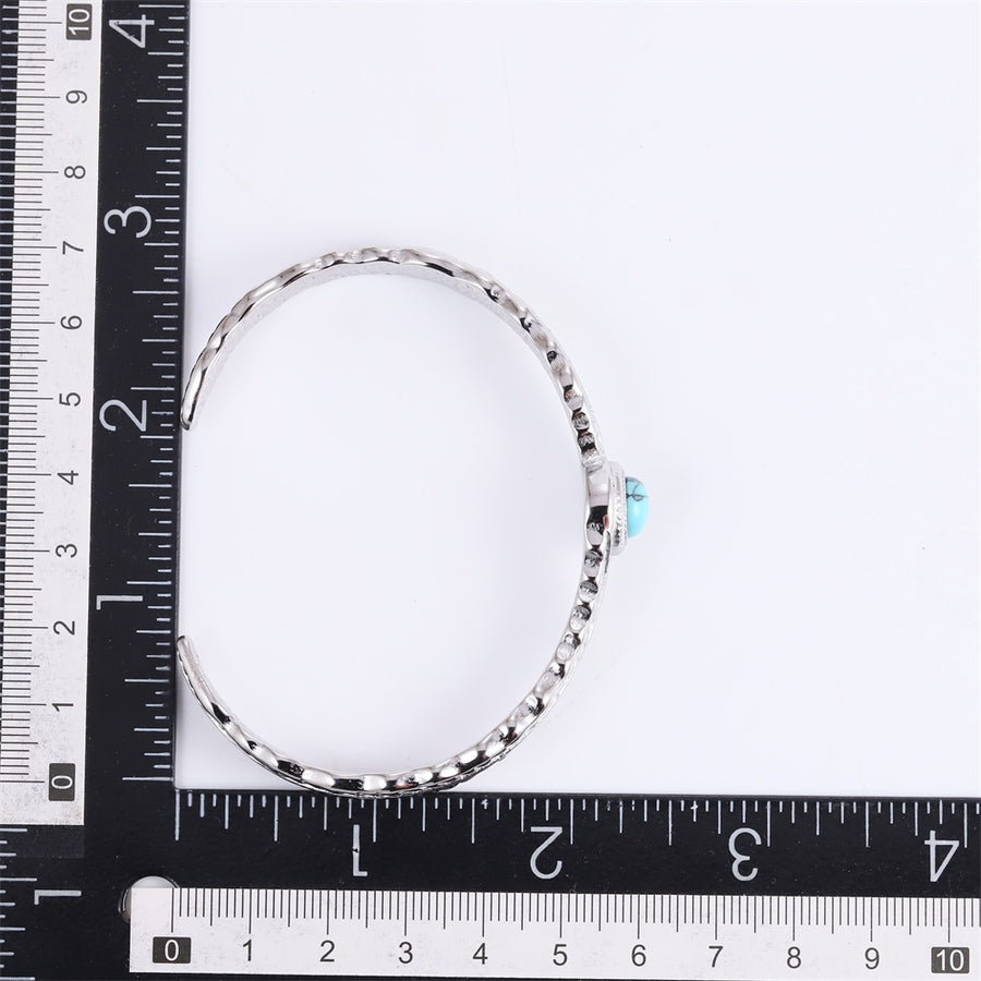 MBSG50 STAINLESS STEEL FEATHER OPEN BANGLE WITH SYNTHETIC TURQUOIZE