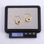 MESS70 STAINLESS STEEL TWISTED HOOP EARRING
