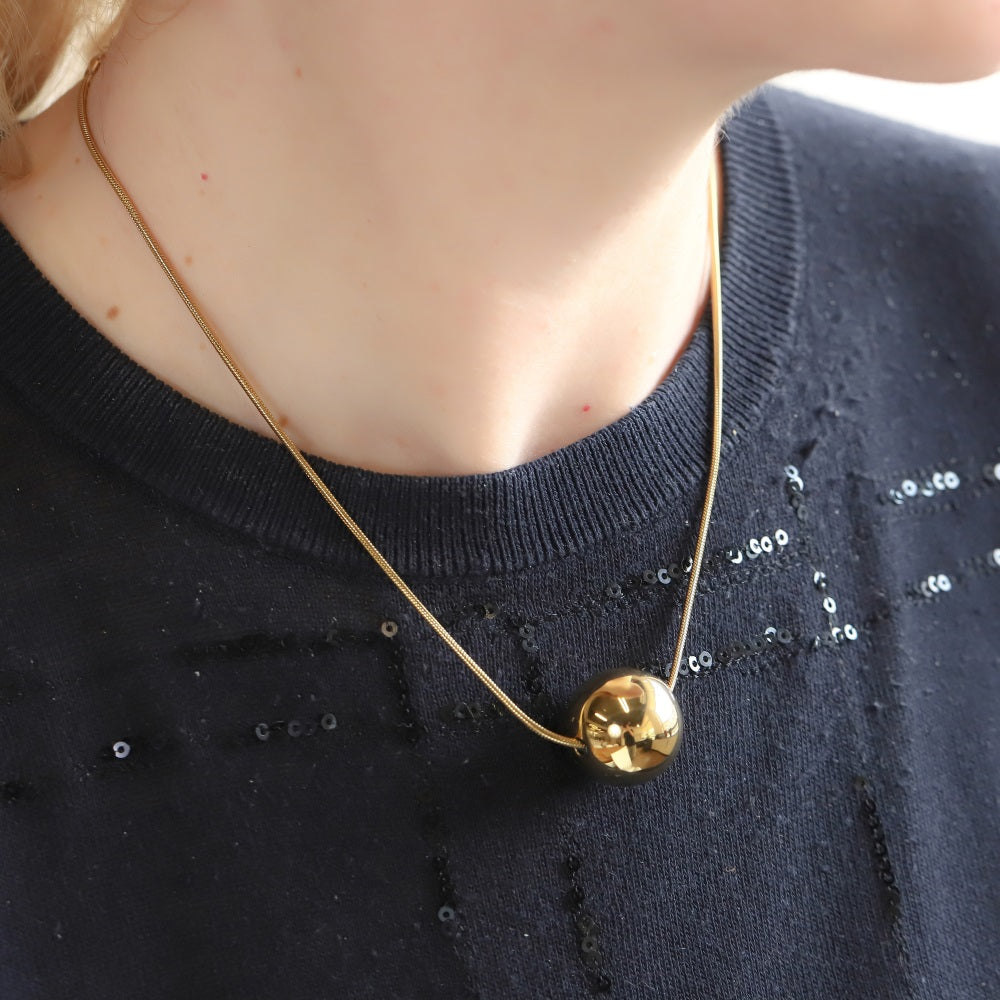MNSS57 STAINLESS STEEL NECKLACE WITH HOLLOW BALL PENDANT AND ROUND SNAKE CHAIN
