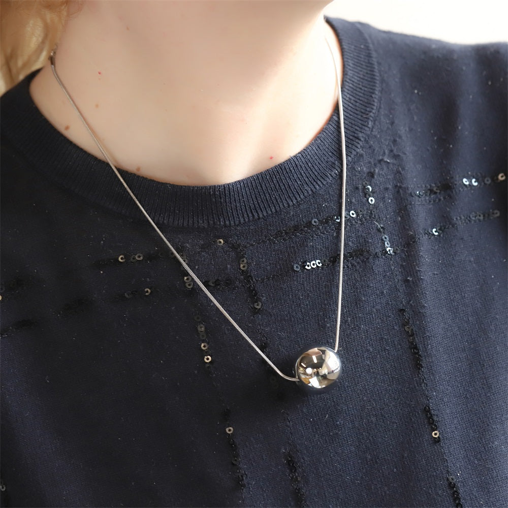 MNSS57 STAINLESS STEEL NECKLACE WITH HOLLOW BALL PENDANT AND ROUND SNAKE CHAIN