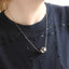 MNSS57 STAINLESS STEEL NECKLACE WITH HOLLOW BALL PENDANT AND ROUND SNAKE CHAIN