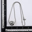 MNSS57 STAINLESS STEEL NECKLACE WITH HOLLOW BALL PENDANT AND ROUND SNAKE CHAIN