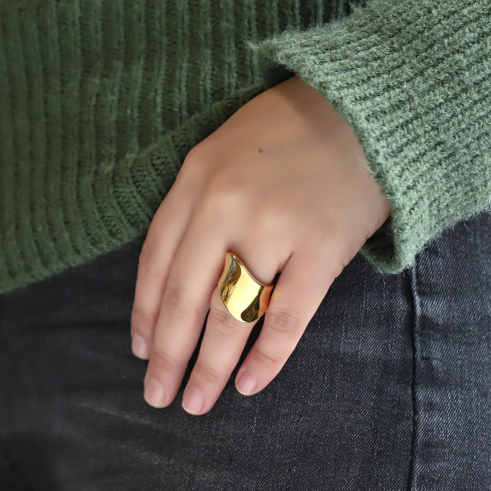 AAB stainless steel ring in polished gold finish with modern sculptural shape, custom unisex jewelry supplier