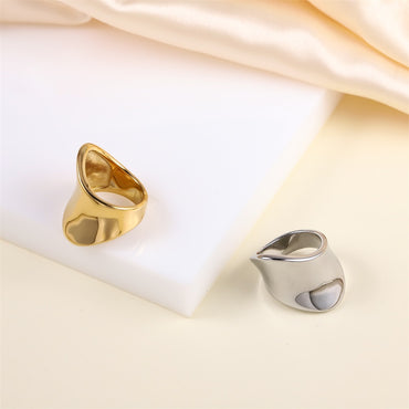AAB stainless steel ring in polished gold finish with modern sculptural shape, custom unisex jewelry supplier