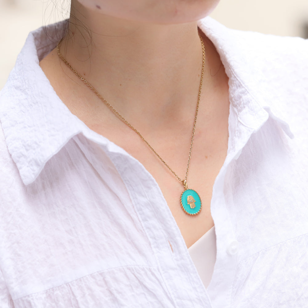 PSS1234 STAINLESS STEEL OVAL PENDANT WITH HAMSA DESIGN AAB CO..