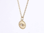 PSS1235 STAINLESS STEEL ROUND PENDANT WITH EVIL EYE DESIGN