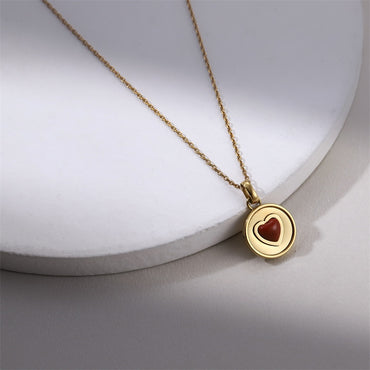 PSS1394 STAINLESS STEEL ROUND PENDANT WITH HEART NATURAL RED STONE