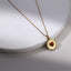 PSS1394 STAINLESS STEEL ROUND PENDANT WITH HEART NATURAL RED STONE
