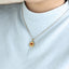 PSS1394 STAINLESS STEEL ROUND PENDANT WITH HEART NATURAL RED STONE