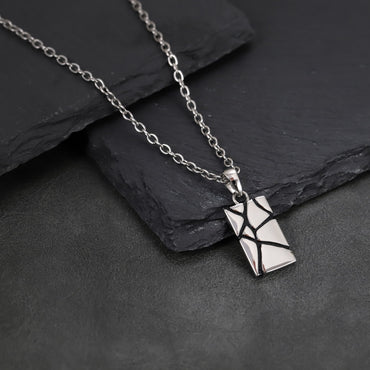 PSS1397  STAINLESS STEEL RECTANGLE PENDANT WITH ROCK DESIGN