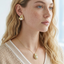 TES69 BRASS TEXTURED LEAF EARRING WITH PEARL&CZ