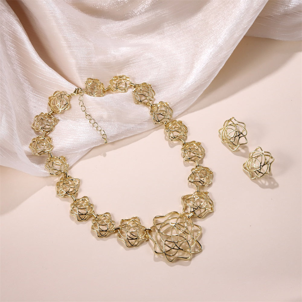 TES82 BASE METAL OPENWORK FLORAL STUD EARRING