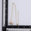 TNS96 BASE METAL NECKLACE WITH FLORAL CHARM